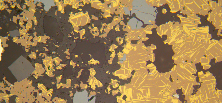 Thin section view of a rock containing tin and indium